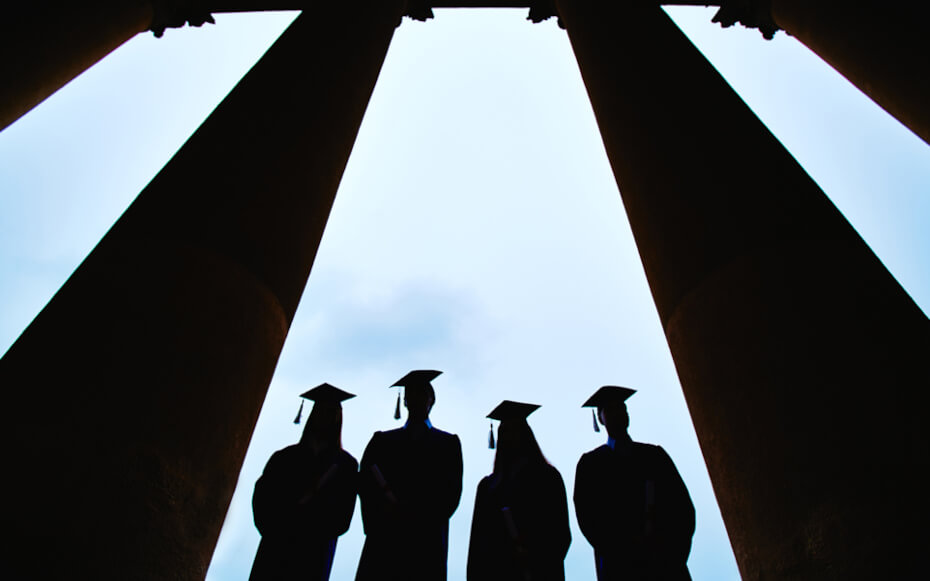 four graduates standing