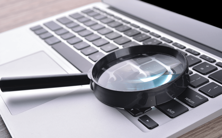 Picture of a laptop with magnifying glass