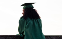 A silhouette of a college graduate.
