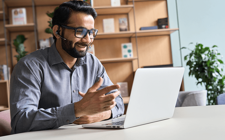 A man works at a laptop.