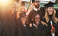 A group of college graduates in their caps and gowns.