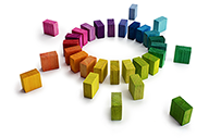 A group of loose blocks being organized into a circle.