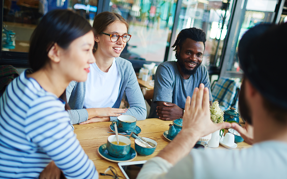 A group of interns reconnect over coffee.