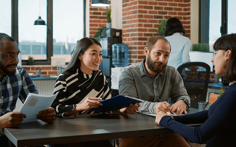 A panel of employers interview a candidate.