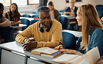 An adult learner talks with a classmate.