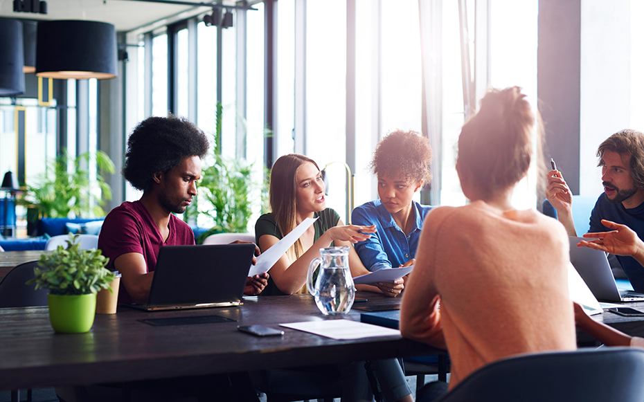 A group of Gen Z employees working on a project.