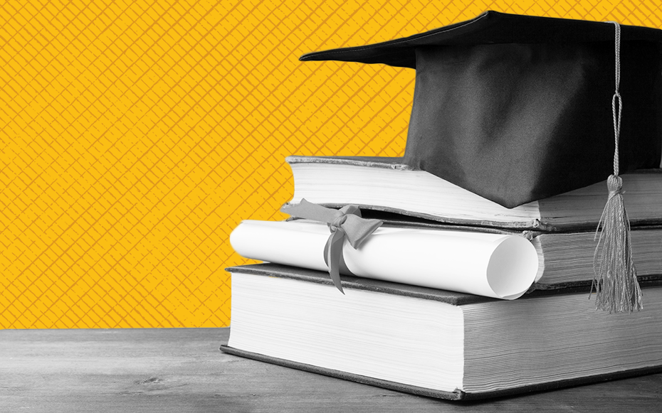 A graduation cap sits on top of a stack of books alongside a degree.