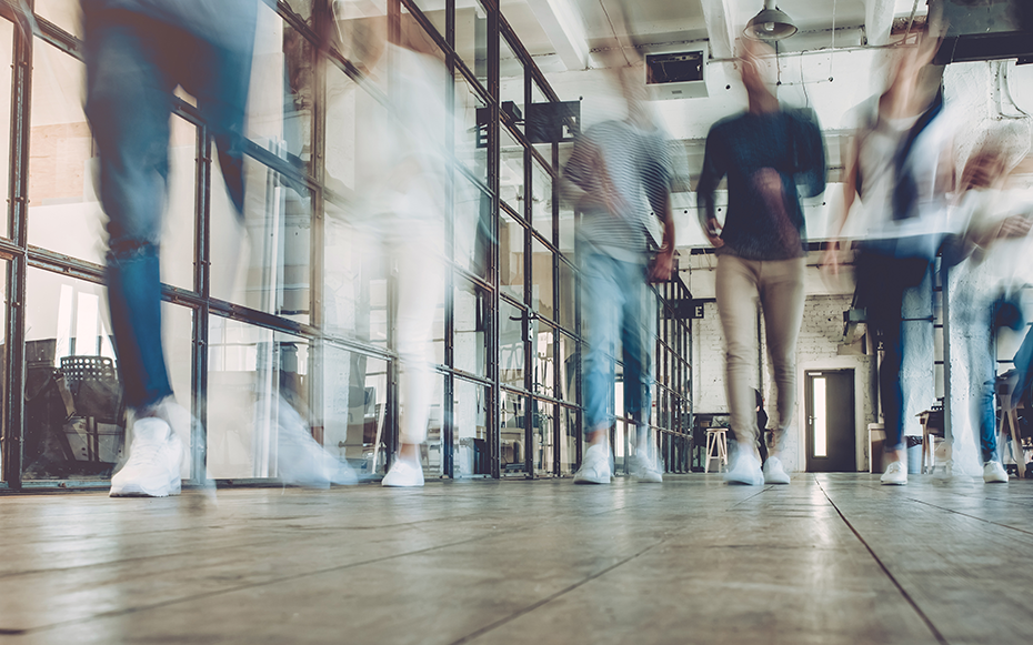 People walking in an office.