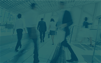A filtered image of people in a workplace.