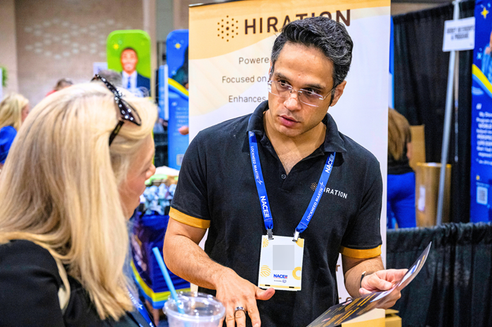 An exhibitor talks to a prospect.