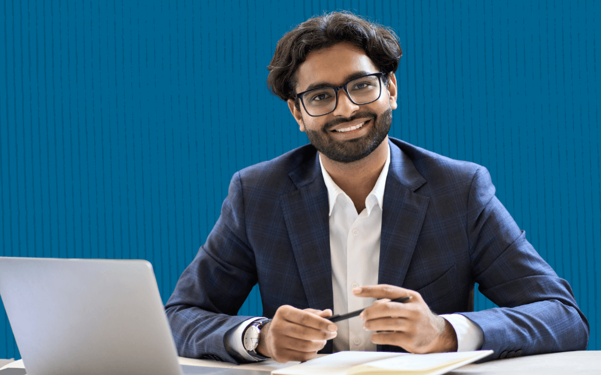 A happy recruiter working at his desk.
