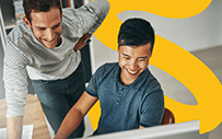 A supervisor reviews the work of a new employee.