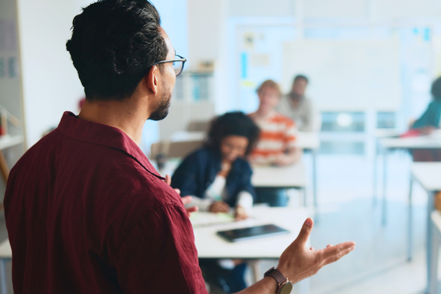 A professor teaches a college class.