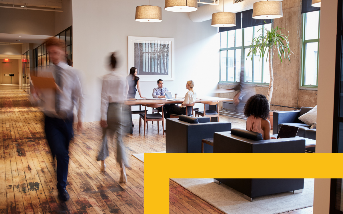 People walking through an office.